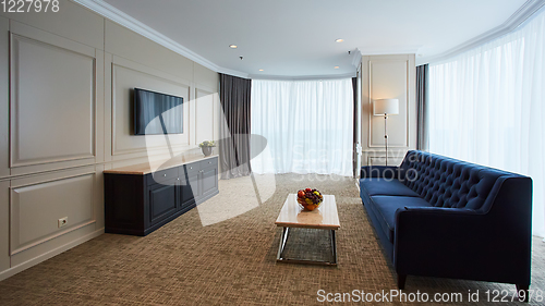 Image of A modern livingroom inside a new flat with TV.