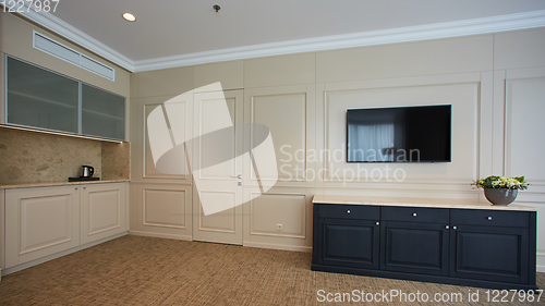 Image of A modern livingroom inside a new flat with TV.