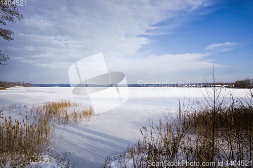 Image of winter landscape with snow covered lake
