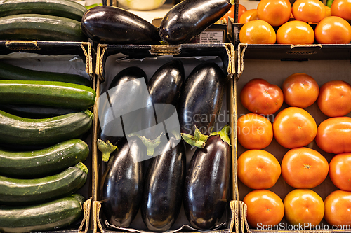 Image of Colorful organic summer bio vegetables, tomatoes, zucchini and eggplant in boxes being sold on local fruit and vegetables market.