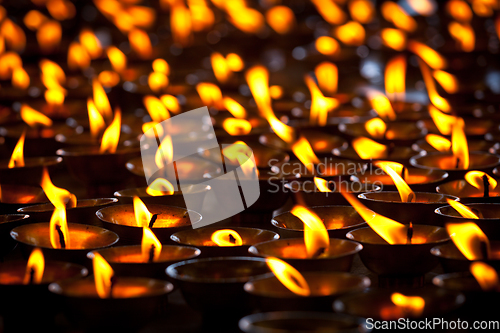 Image of Burning candles in Buddhist temple. McLeod Ganj, Himachal Prades