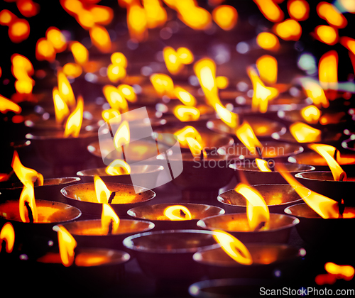 Image of Burning candles in Buddhist temple, McLeod Ganj