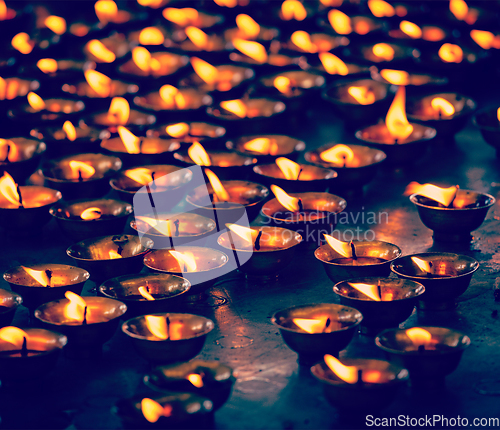 Image of Burning candles in Buddhist temple, McLeod Ganj