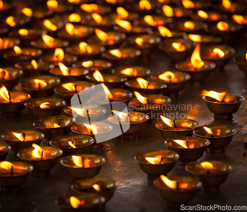 Image of Burning candles in Buddhist temple, McLeod Ganj