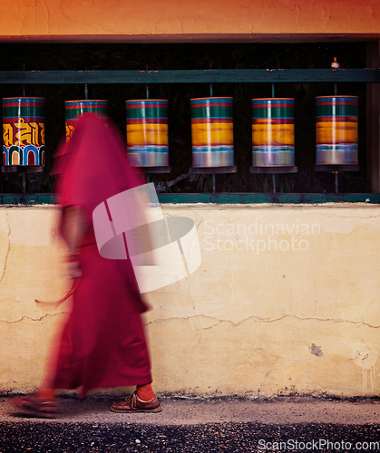 Image of Buddhist monk spinning prayer wheels. McLeod Ganj