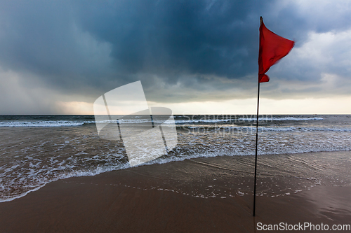 Image of Storm warning flags on beach. Baga, Goa, India