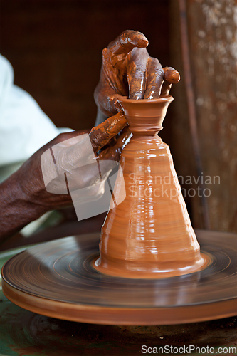 Image of Potter throwing