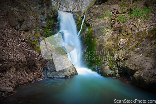 Image of beautiful waterfall in the middle of the wild