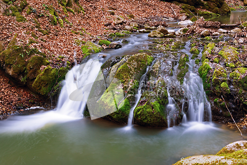 Image of waterfall into the woods