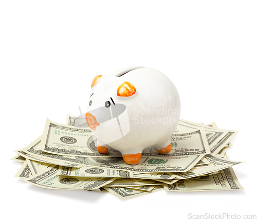 Image of Piggy bank on dollars