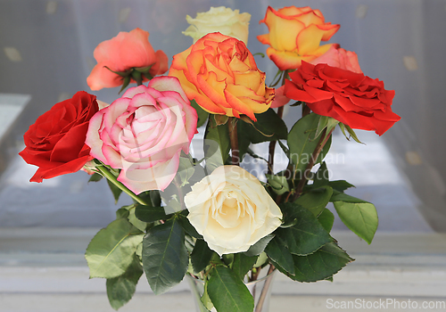 Image of Bouquet of colorful fading roses 