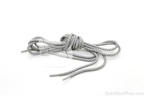 Image of New shoelaces tied in a knot isolated on white background