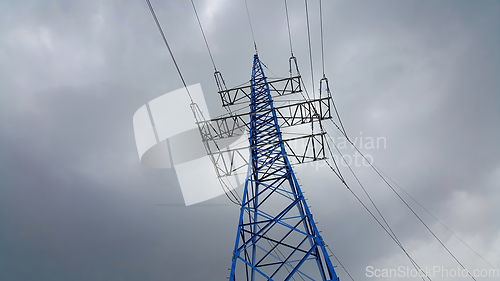 Image of High voltage tower against the cloudy sky