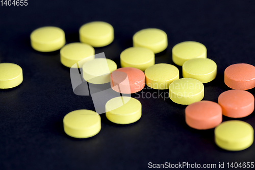 Image of yellow and orange pills