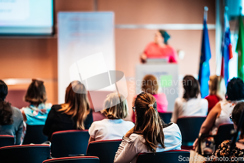 Image of Woman giving presentation on business conference event.