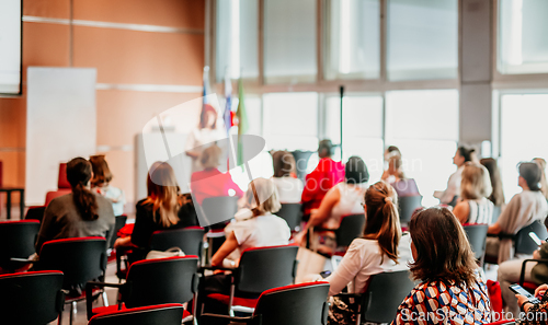 Image of Woman giving presentation on business conference event.