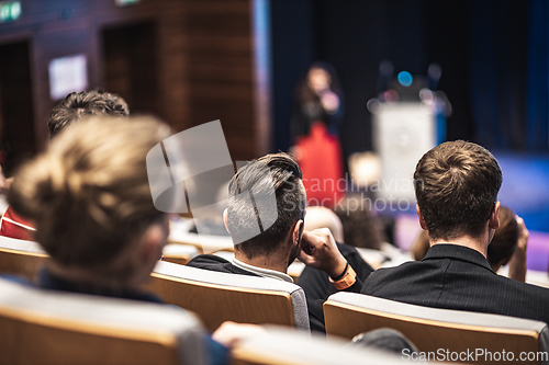 Image of Woman giving presentation on business conference event.