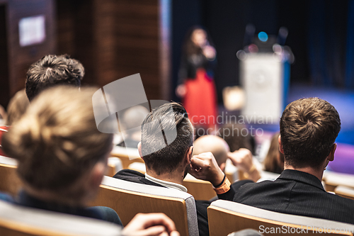 Image of Woman giving presentation on business conference event.