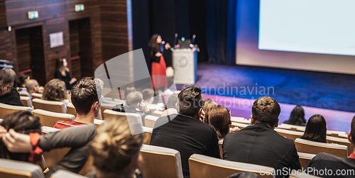 Image of Woman giving presentation on business conference event.