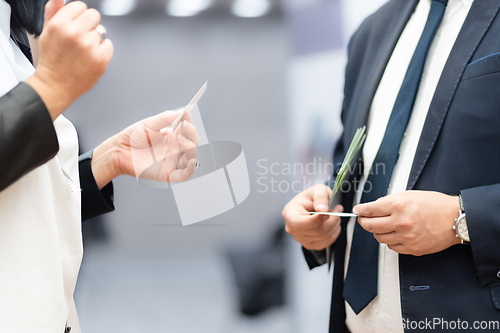 Image of Business people exchanging business card on business meeting, Business discussion talking deal concept