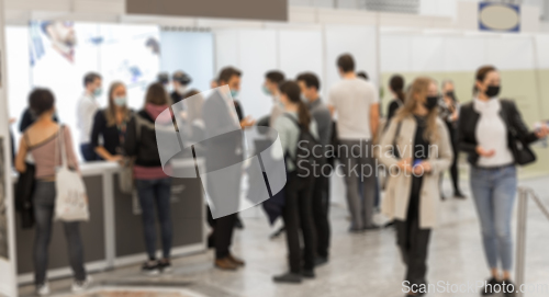 Image of Abstract blured people at exhibition hall of expo event trade show. Business convention show or job fair. Business concept background.