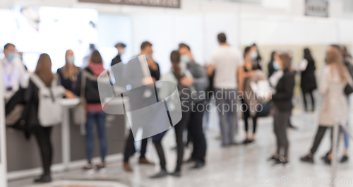 Image of Abstract blured people at exhibition hall of expo event trade show. Business convention show or job fair. Business concept background.