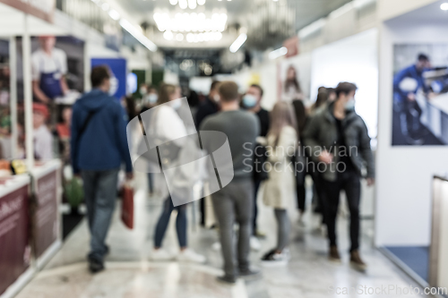 Image of Abstract blured people at exhibition hall of expo event trade show. Business convention show or job fair. Business concept background.