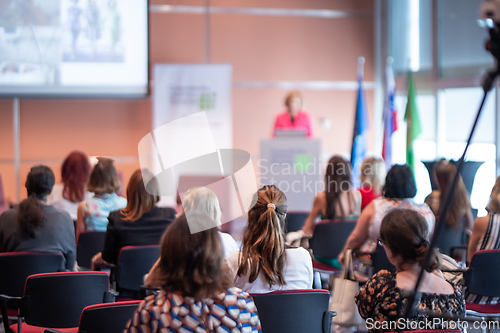 Image of Woman giving presentation on business conference event.