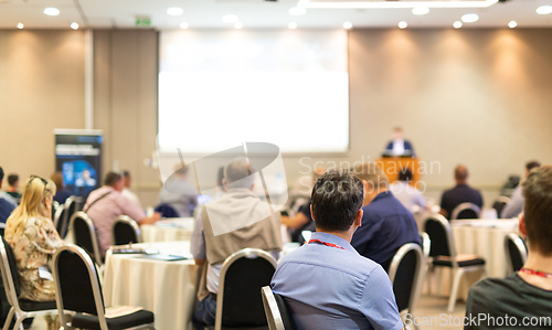 Image of Business speaker giving a talk at business conference event.