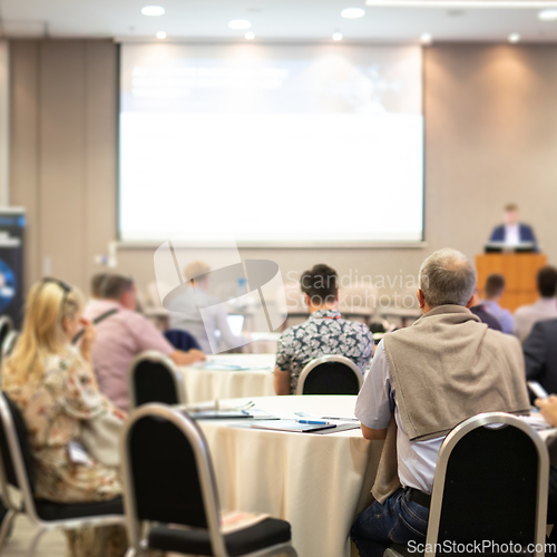 Image of Business speaker giving a talk at business conference event.