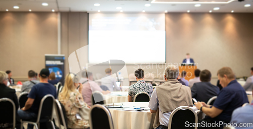 Image of Business speaker giving a talk at business conference event.