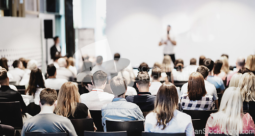 Image of Business speaker giving a talk at business conference event.