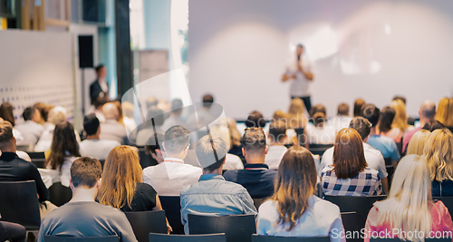 Image of Business speaker giving a talk at business conference event.