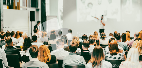 Image of Business speaker giving a talk at business conference event.