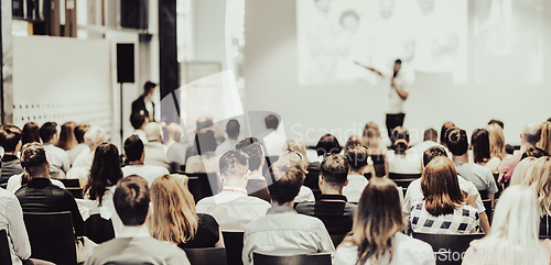 Image of Business speaker giving a talk at business conference event.