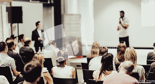 Image of Business speaker giving a talk at business conference event.