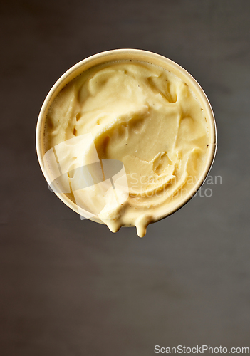 Image of paper cup of vanilla ice cream