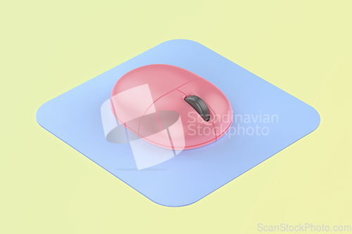 Image of Pink computer mouse with blue mouse pad