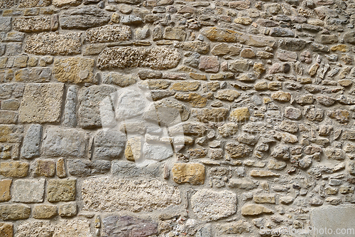 Image of Very ancient stone wall, closeup texture