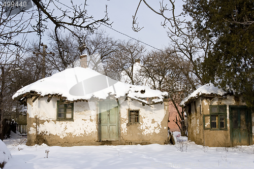 Image of traditional mud built farmhouse in winter