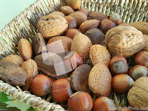 Image of Various nuts in a wicker bowl