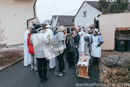 Image of People attend the Slavic Carnival Masopust