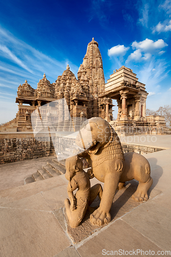 Image of King and lion fight statue and Kandariya Mahadev temple