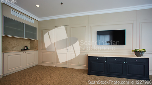 Image of A modern livingroom inside a new flat with TV.