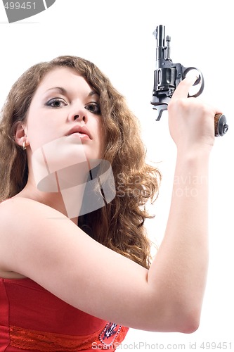 Image of Young woman with a revolver. Isolated on white