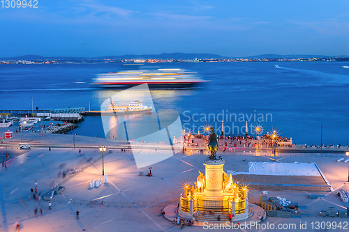 Image of evening Lisbon embankment, cruise liner