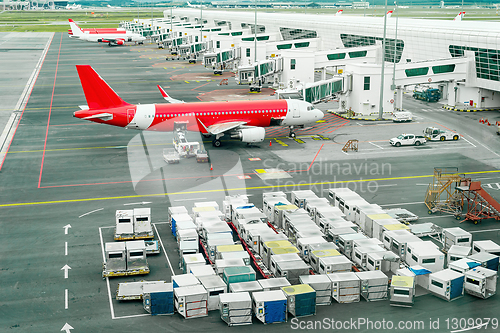 Image of Airplains and freight containers in airport 