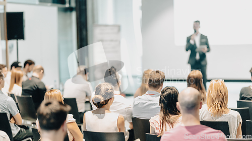 Image of Business speaker giving a talk at business conference event.