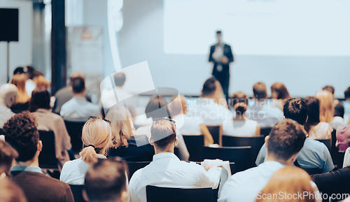 Image of Business speaker giving a talk at business conference event.