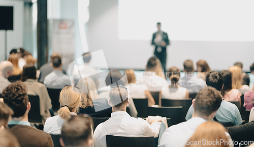 Image of Business speaker giving a talk at business conference event.